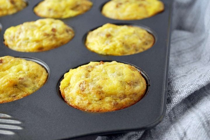 sausage egg muffins fresh from the oven in a muffin pan