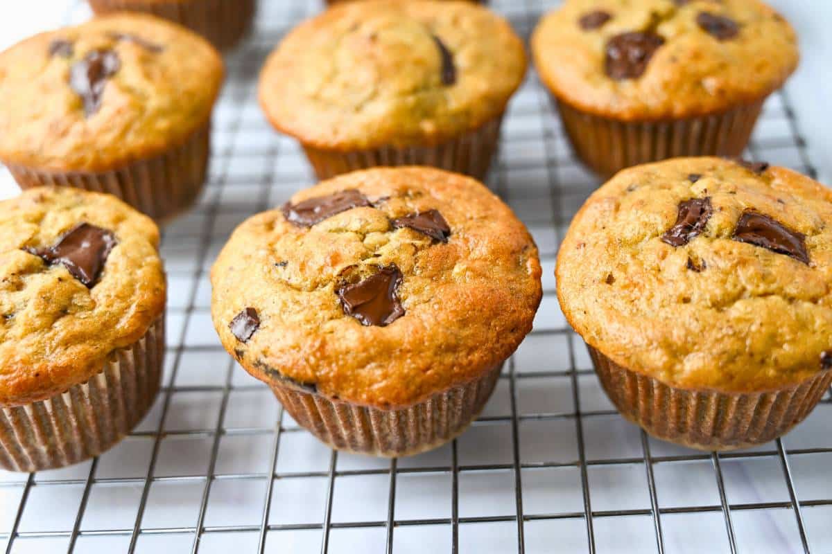 chocolate banana muffins cooling on a rack