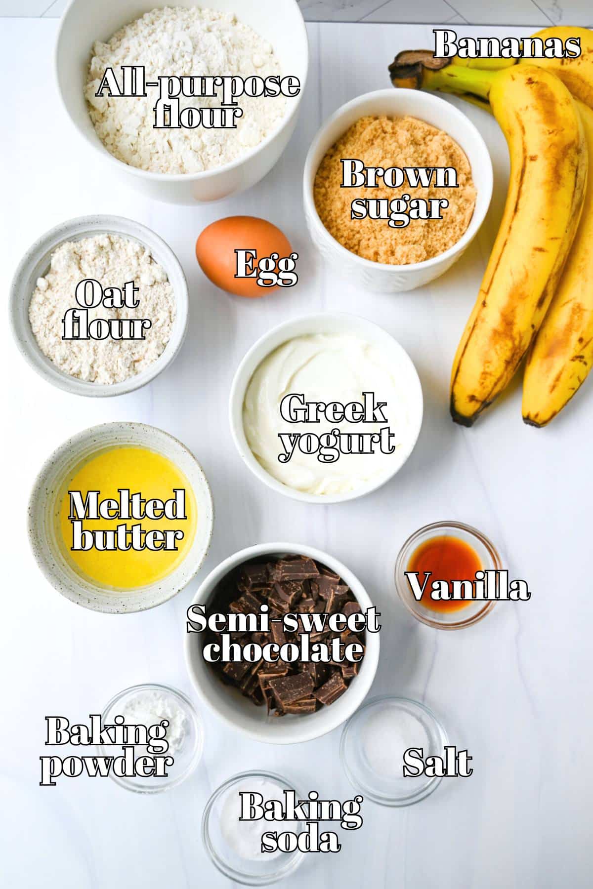 ingredients for banana muffins with chopped chocolate measured out on a counter