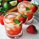 close up of two strawberry mojitos in low ball glasses