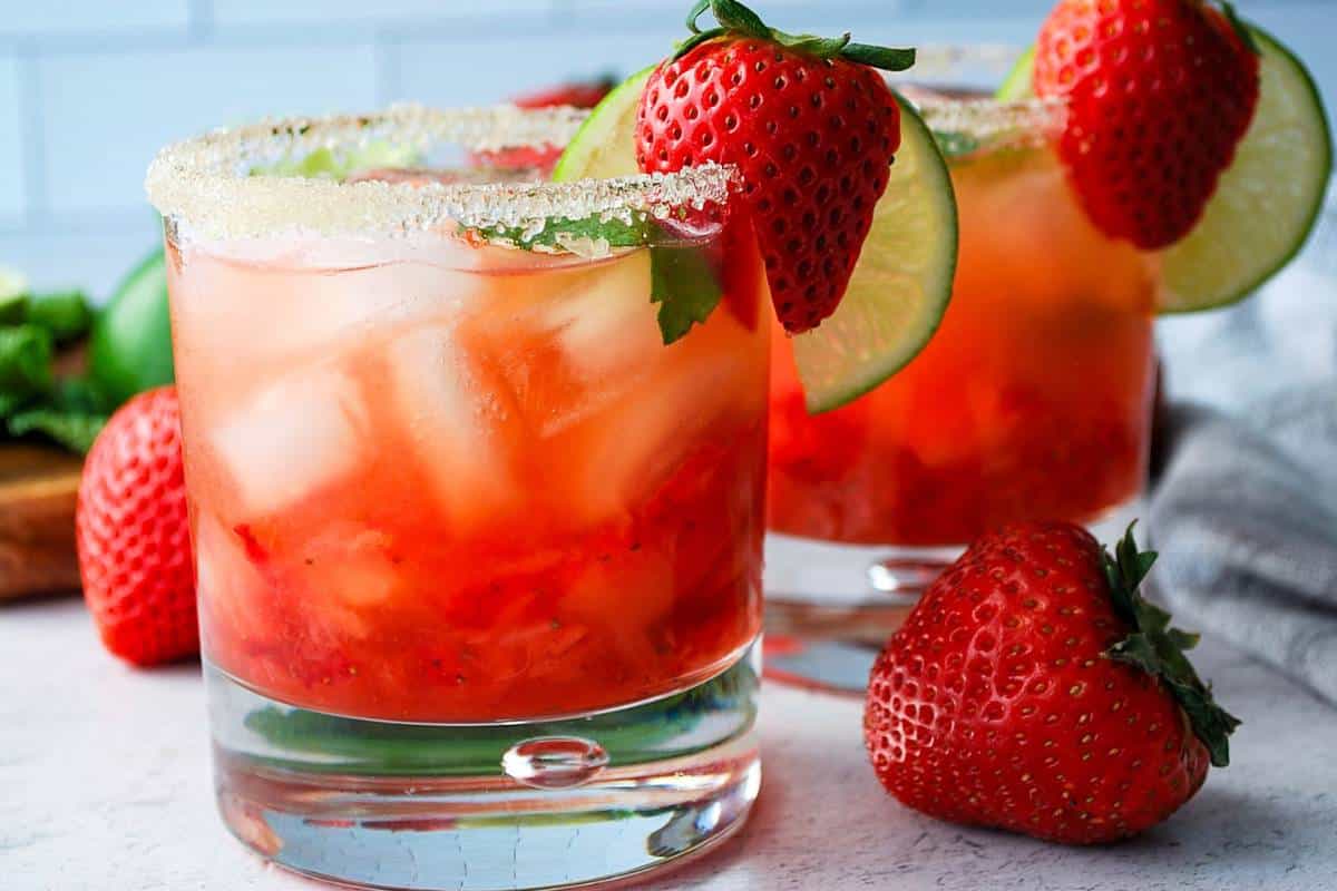 close up of two strawberry mojitos