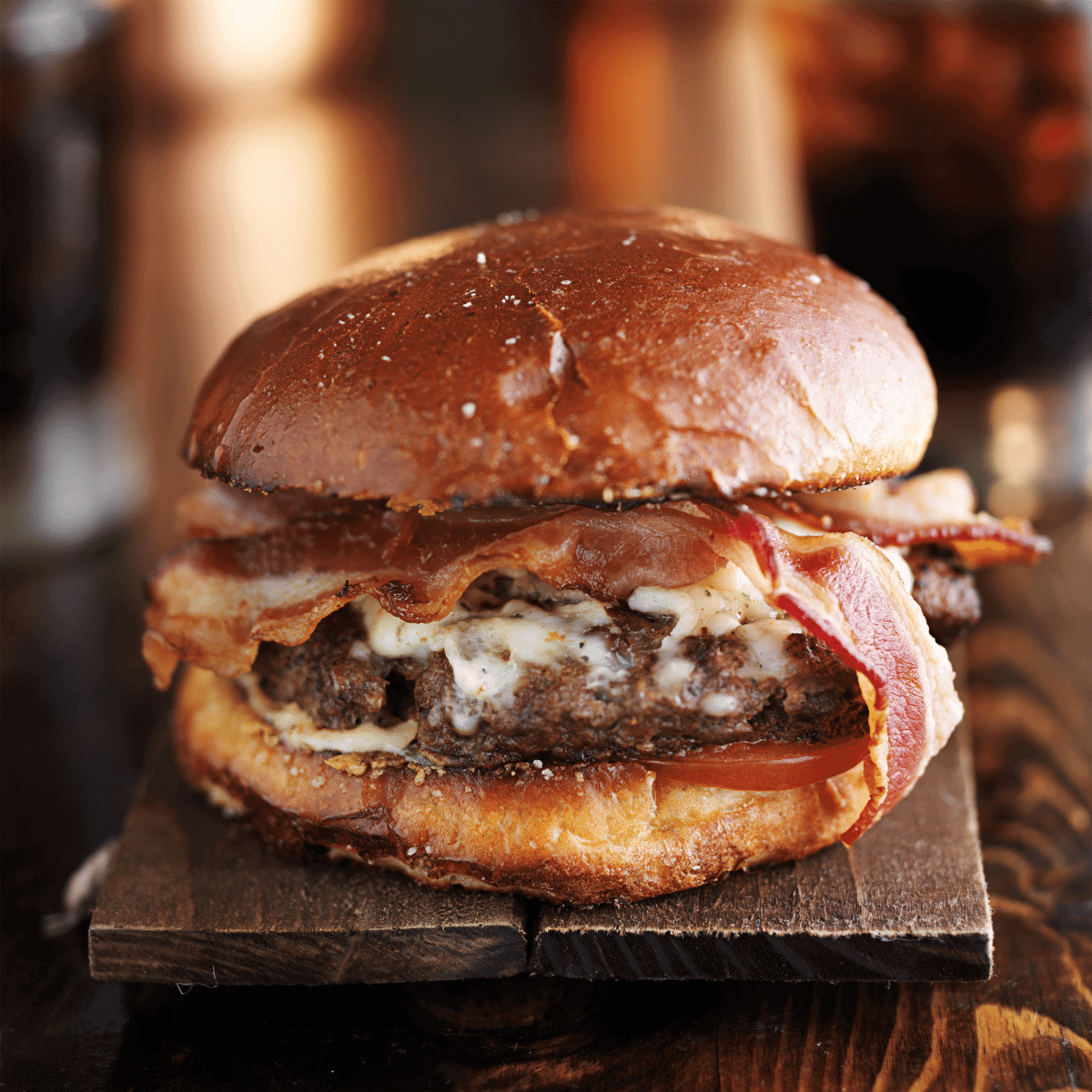 juicy smoked burger on a cutting board