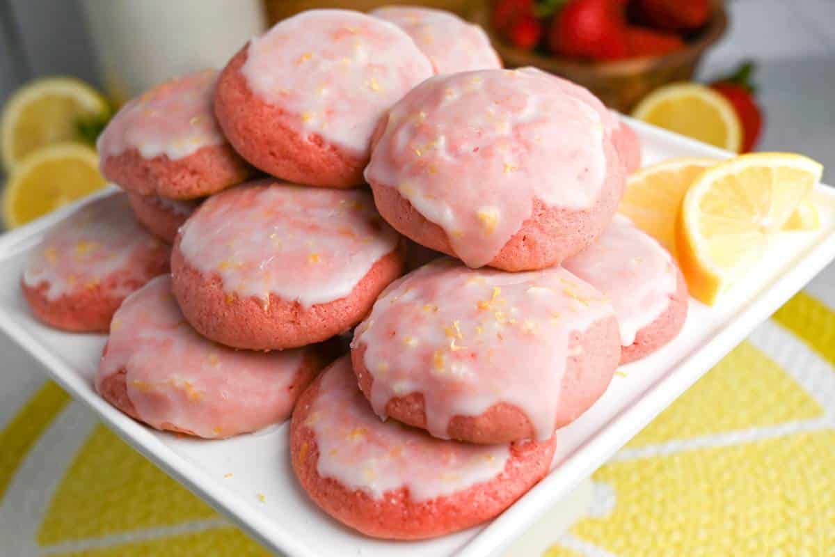 a plate of strawberry cookies with lemon slices