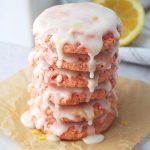 close up of a stack of strawberry cookie dripping with lemon glaze