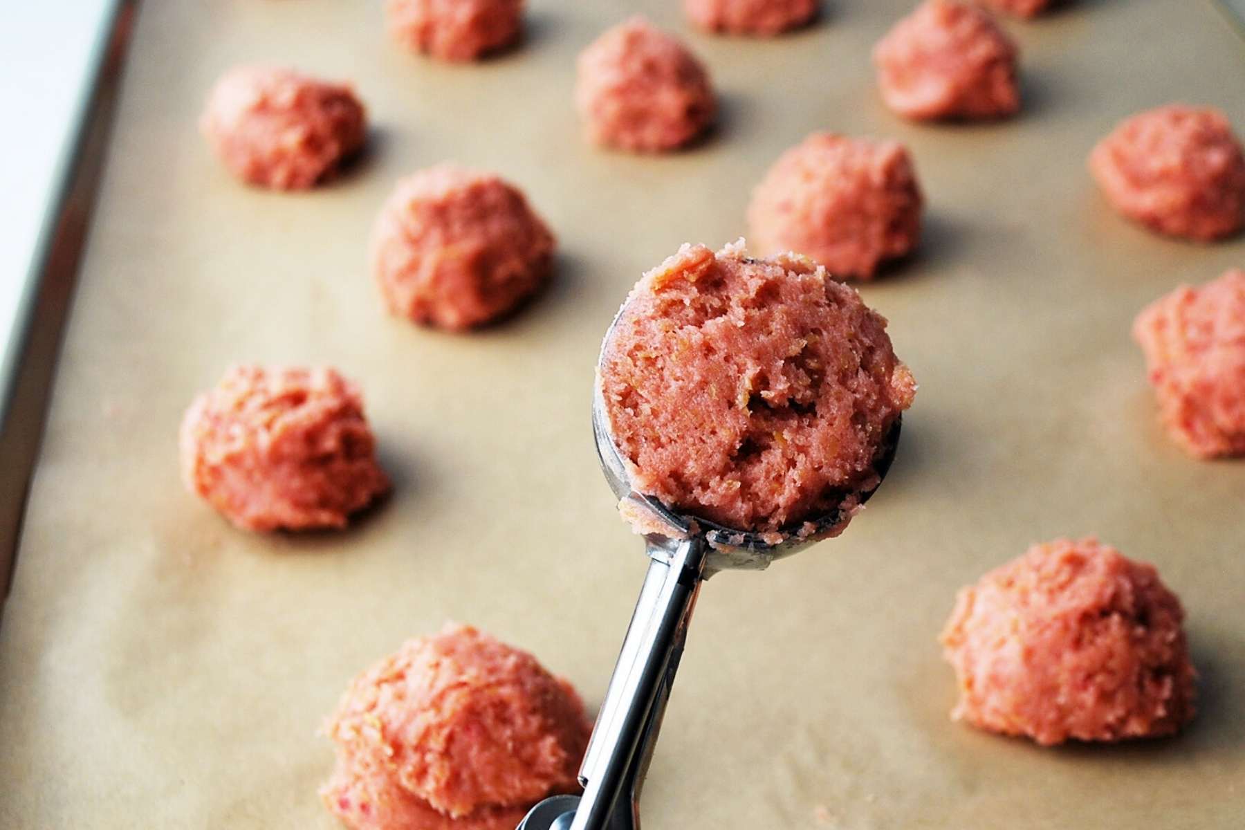 strawberry cookie batter in a cookie scoop