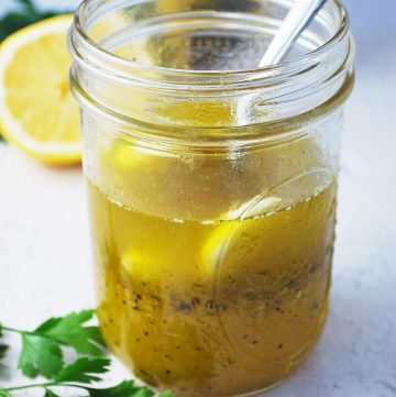 lemon pepper marinade in a mason jar with a spoon