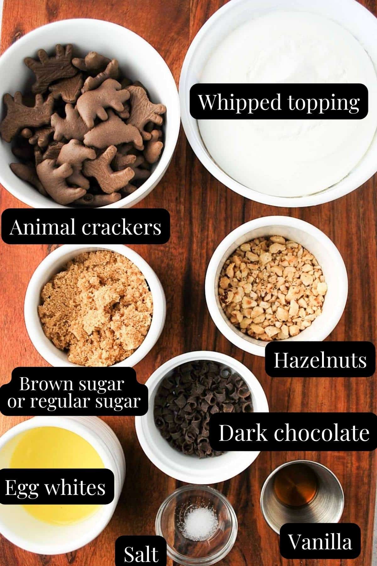 ingredients for a chocolate hazelnut pie made with ground chocolate animal crackers measured out on a counter