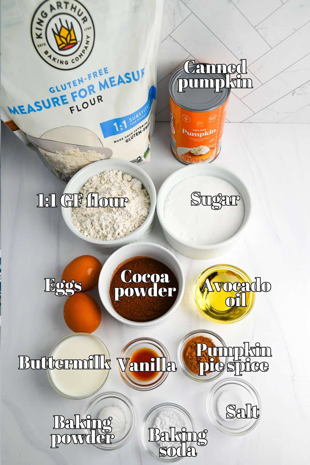 ingredients to make a GF pumpkin chocolate cake measured out on a counter