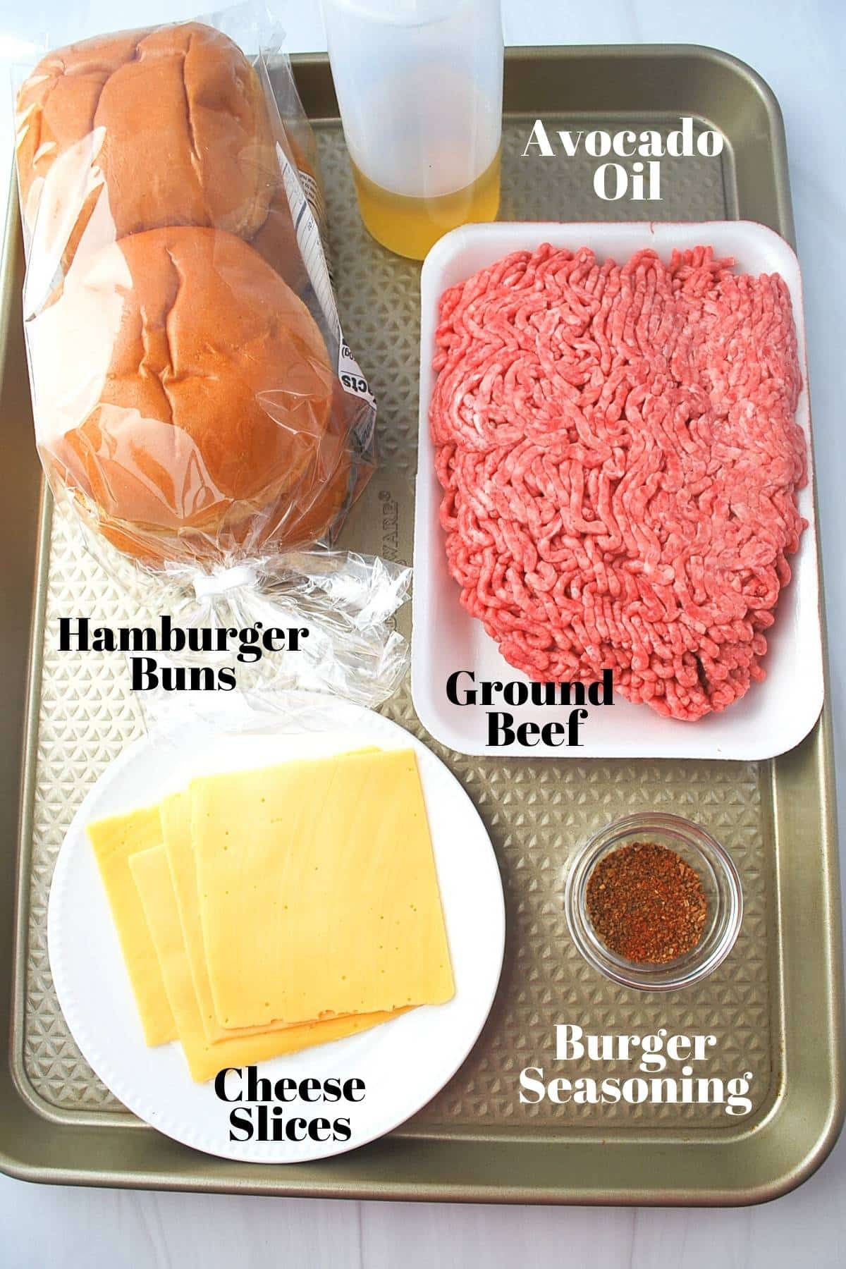 ingredients for making smash burgers on a tray 