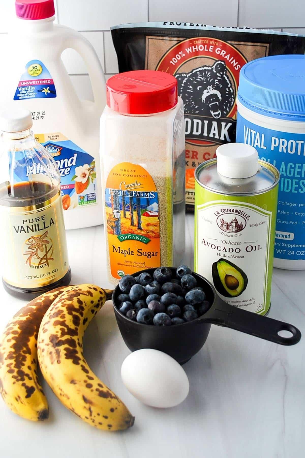 ingredients for protein blueberry muffins on a counter