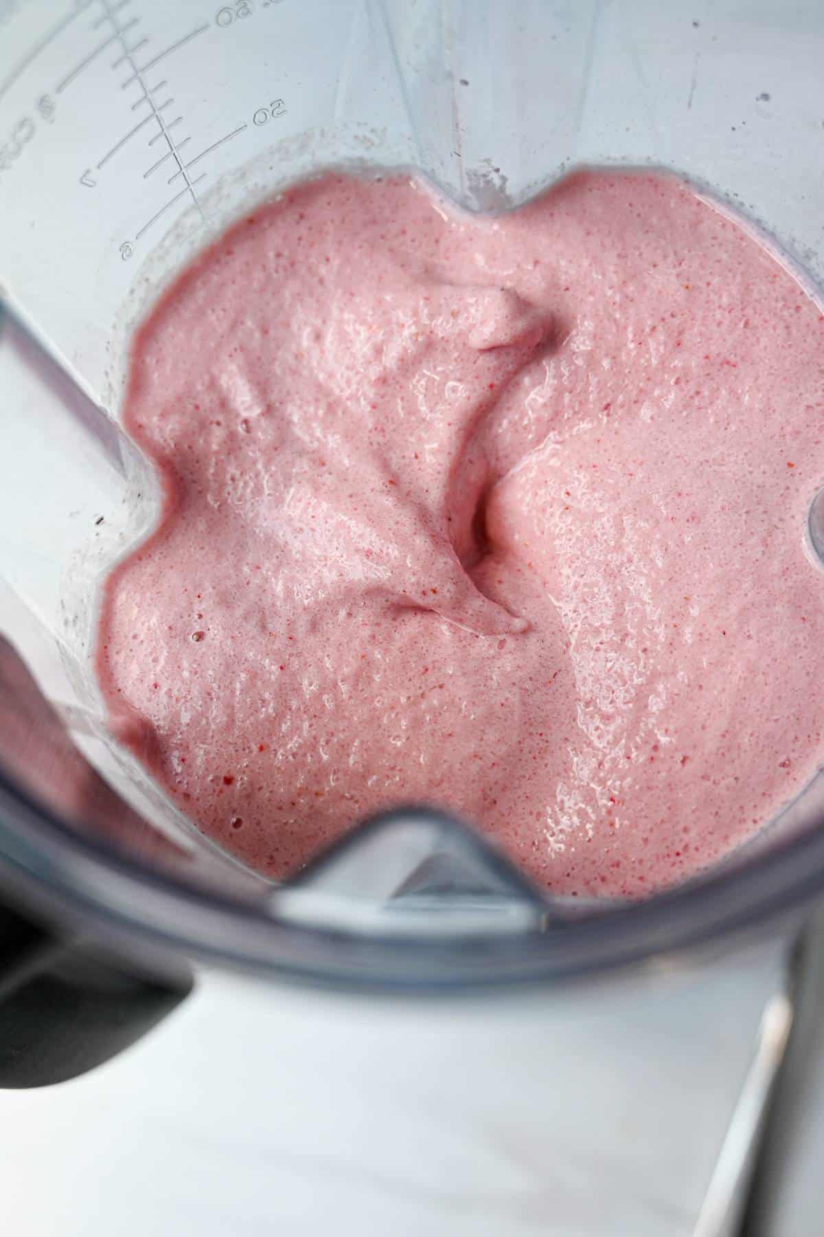 soft serve strawberry ice cream in a blender container