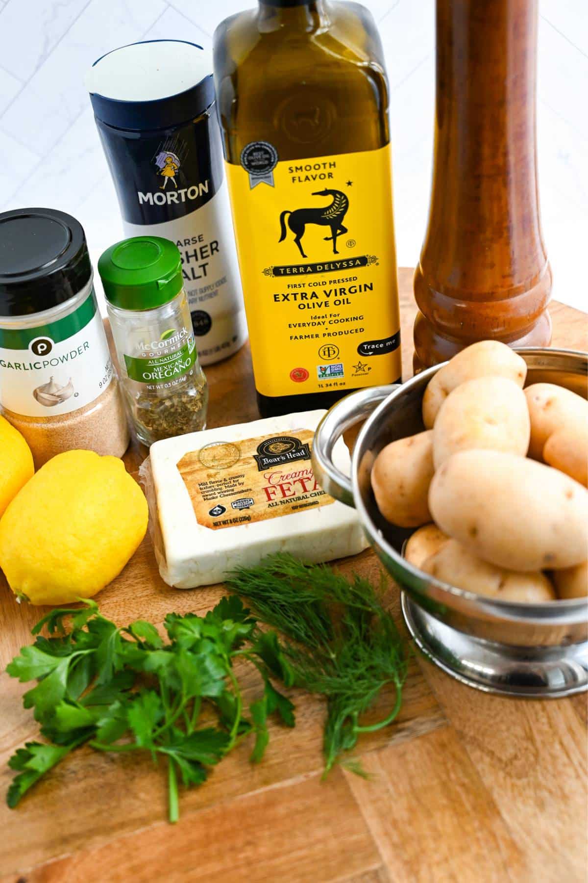 ingredients for making air fried greek potatoes on a countertop