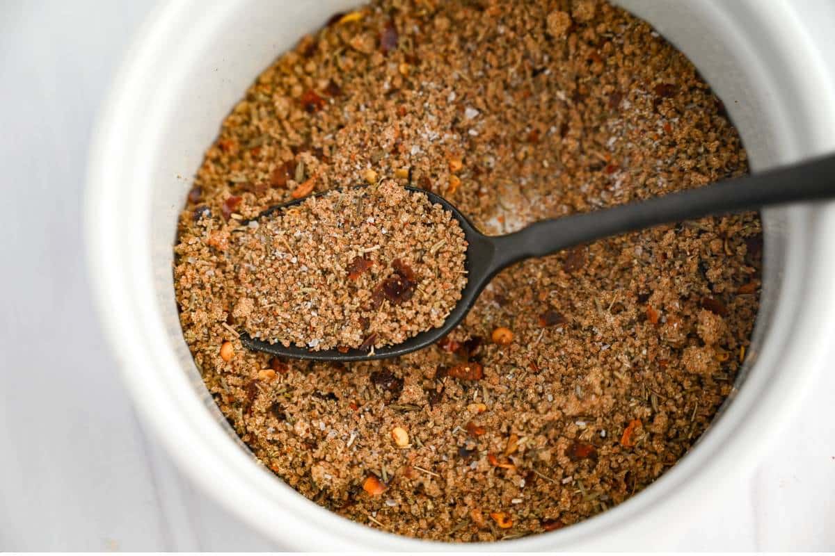 sausage seasoning mixed in a bowl with a spoon