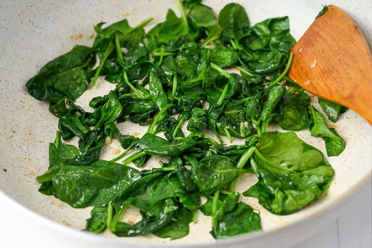 wilted spinach in a skillet
