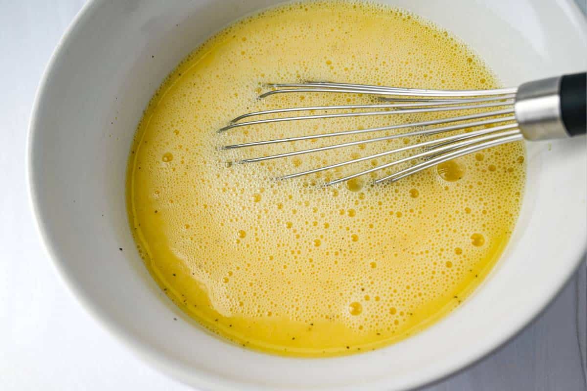 whisked eggs and light cream in a bowl