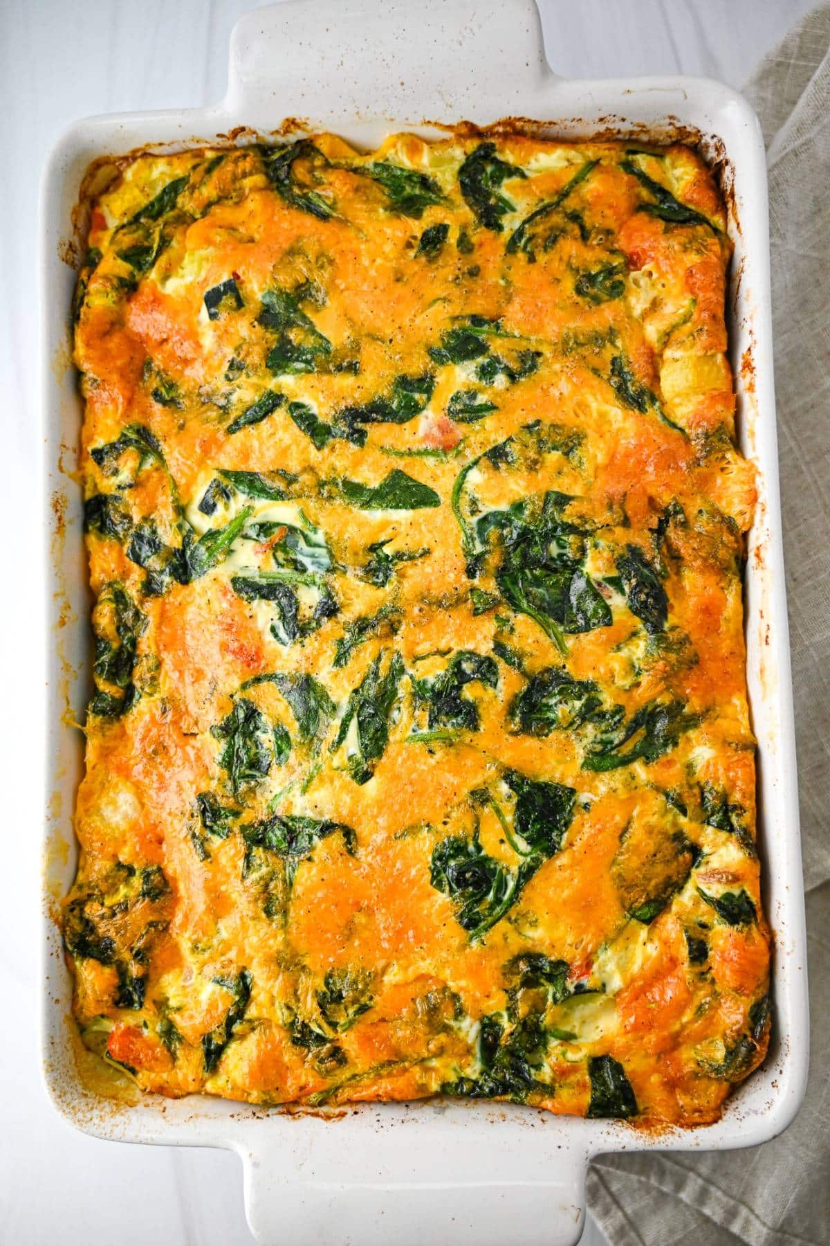 a baked protein breakfast casserole with a napkin