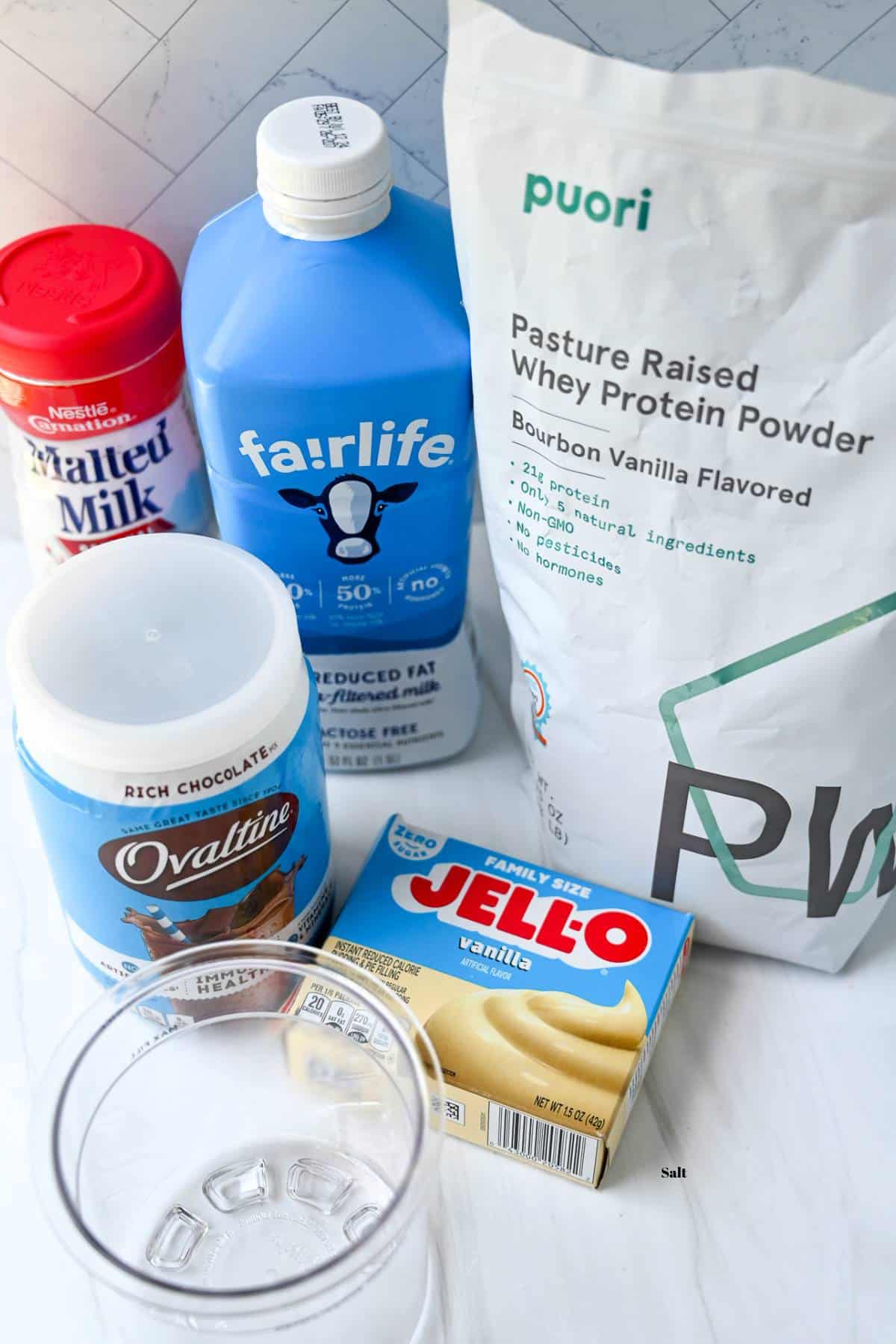 ingredients for chocolate malt ninja creami protein ice cream on a counter