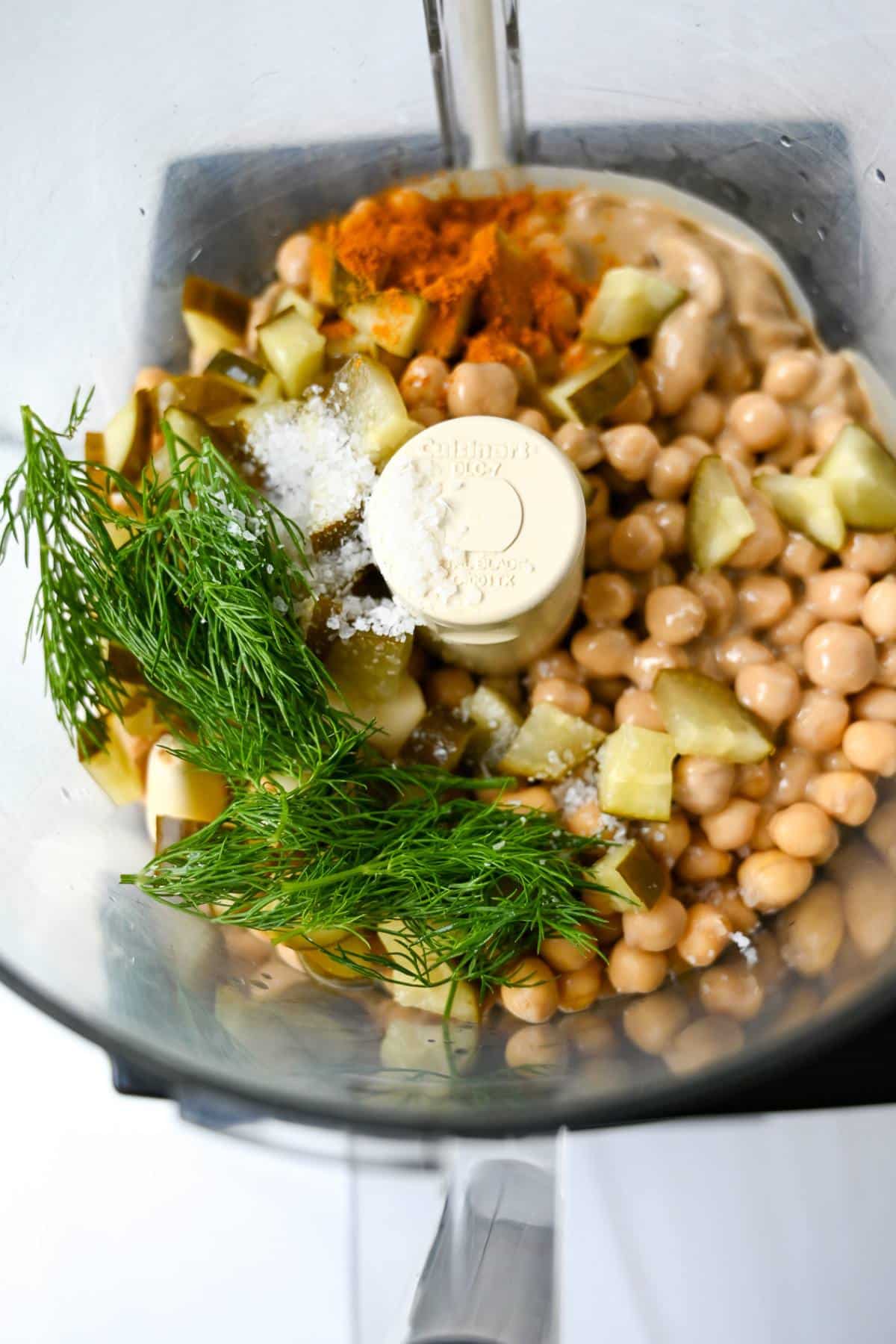 dill hummus ingredients in a food processor ready to blend