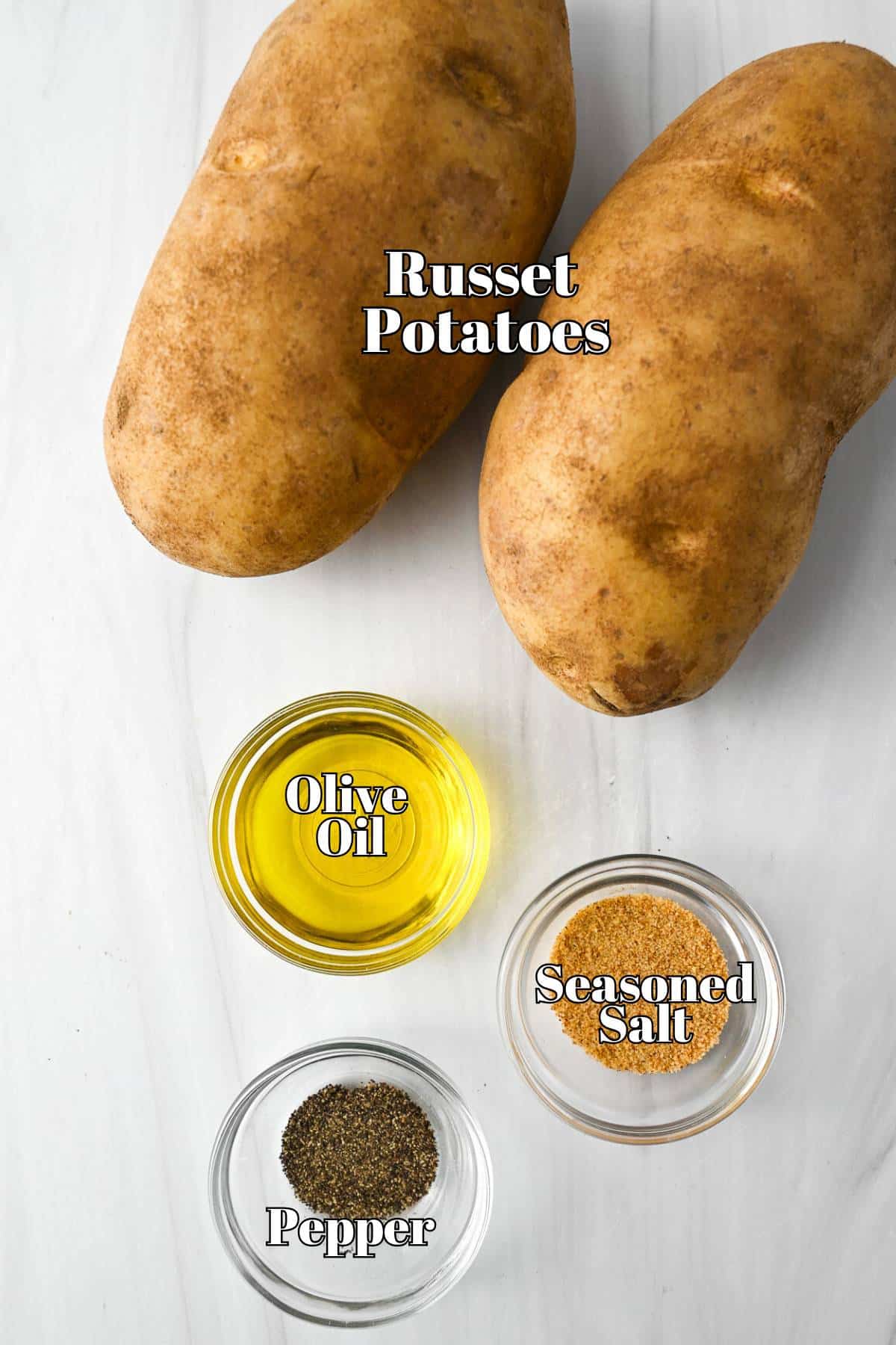 potatoes, olive oil, and seasonings on a counter top