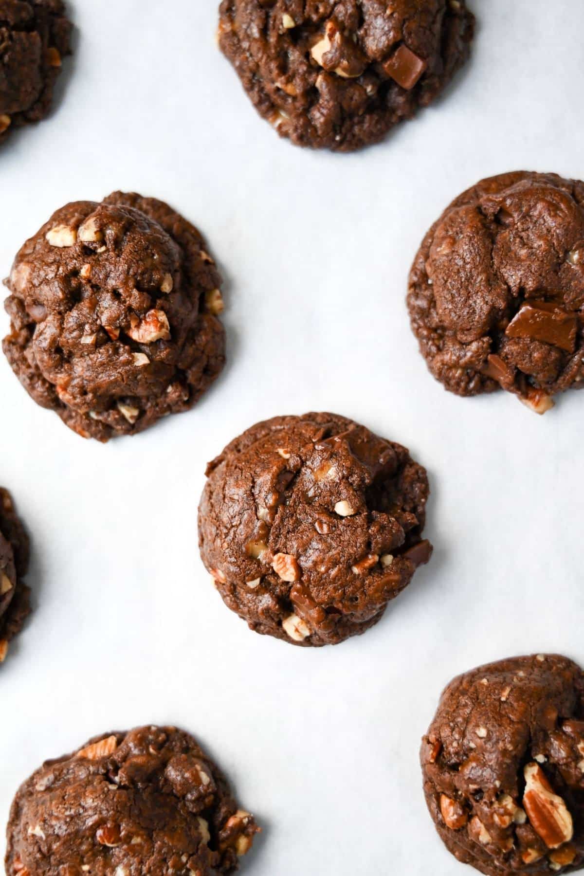 This easy-to-follow Chocolate Crunch Cookies recipe delivers THE BEST double chocolate cookies with bonus chocolate chunks, pecans, and toffee bits in every bite! via @Ameessavorydish