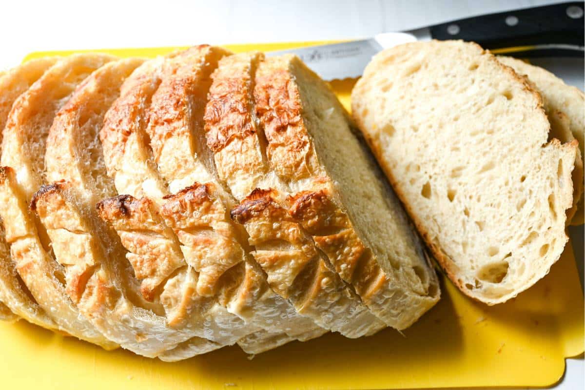 a sliced boule of sourdough on a cutting board