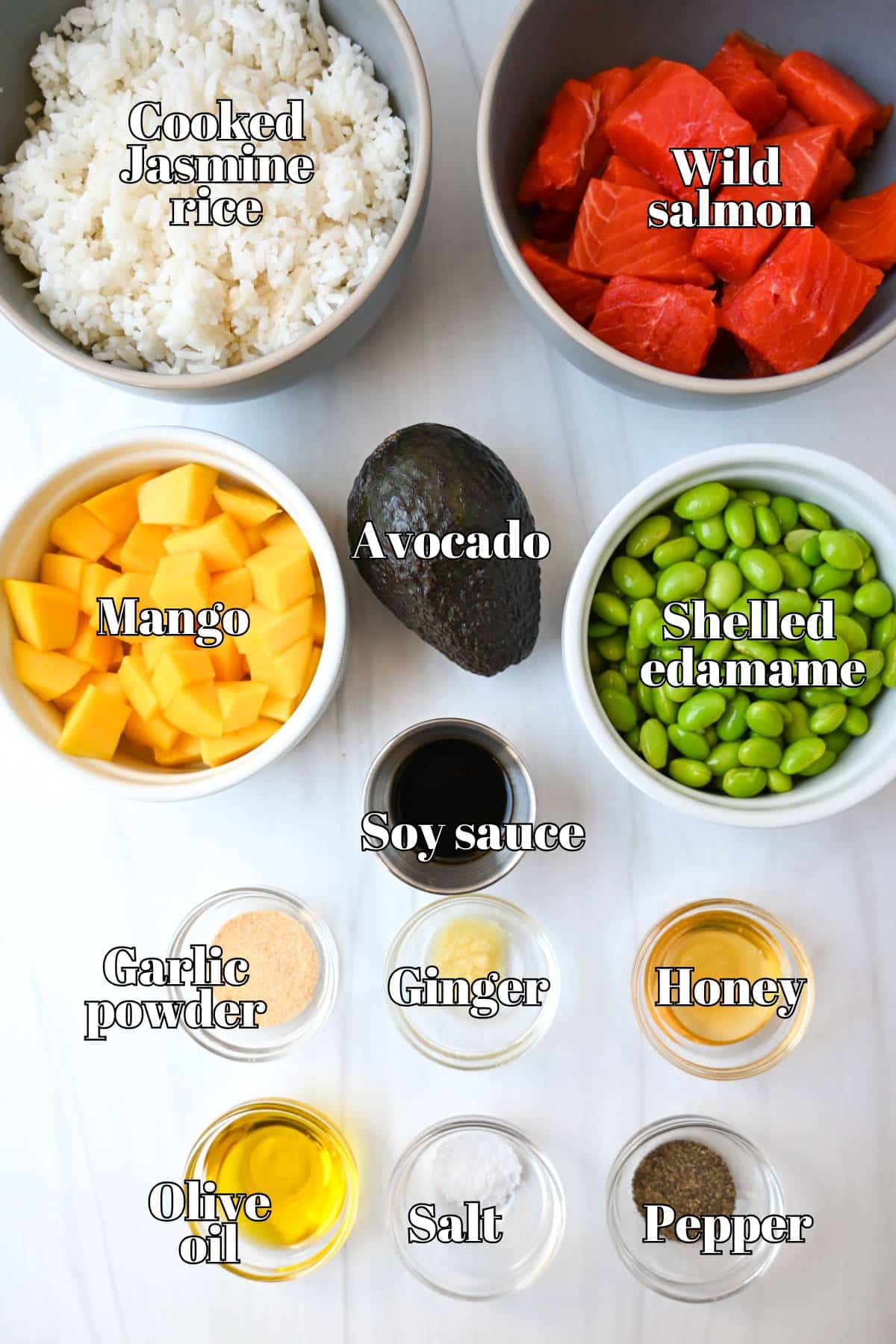 ingredients for salmon bowls measured out on a counter ready to cook