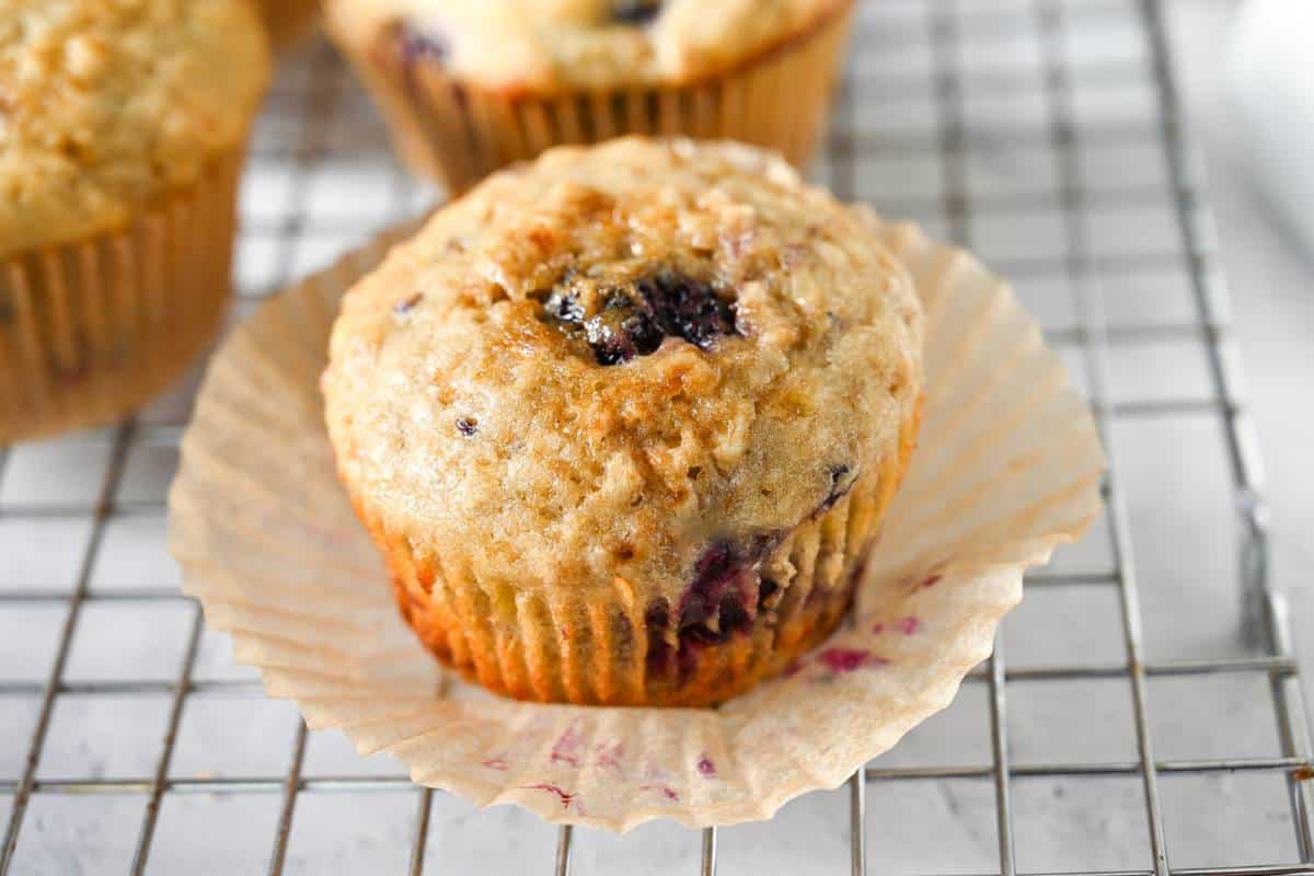 a banana muffin unwrapped from the muffin liner