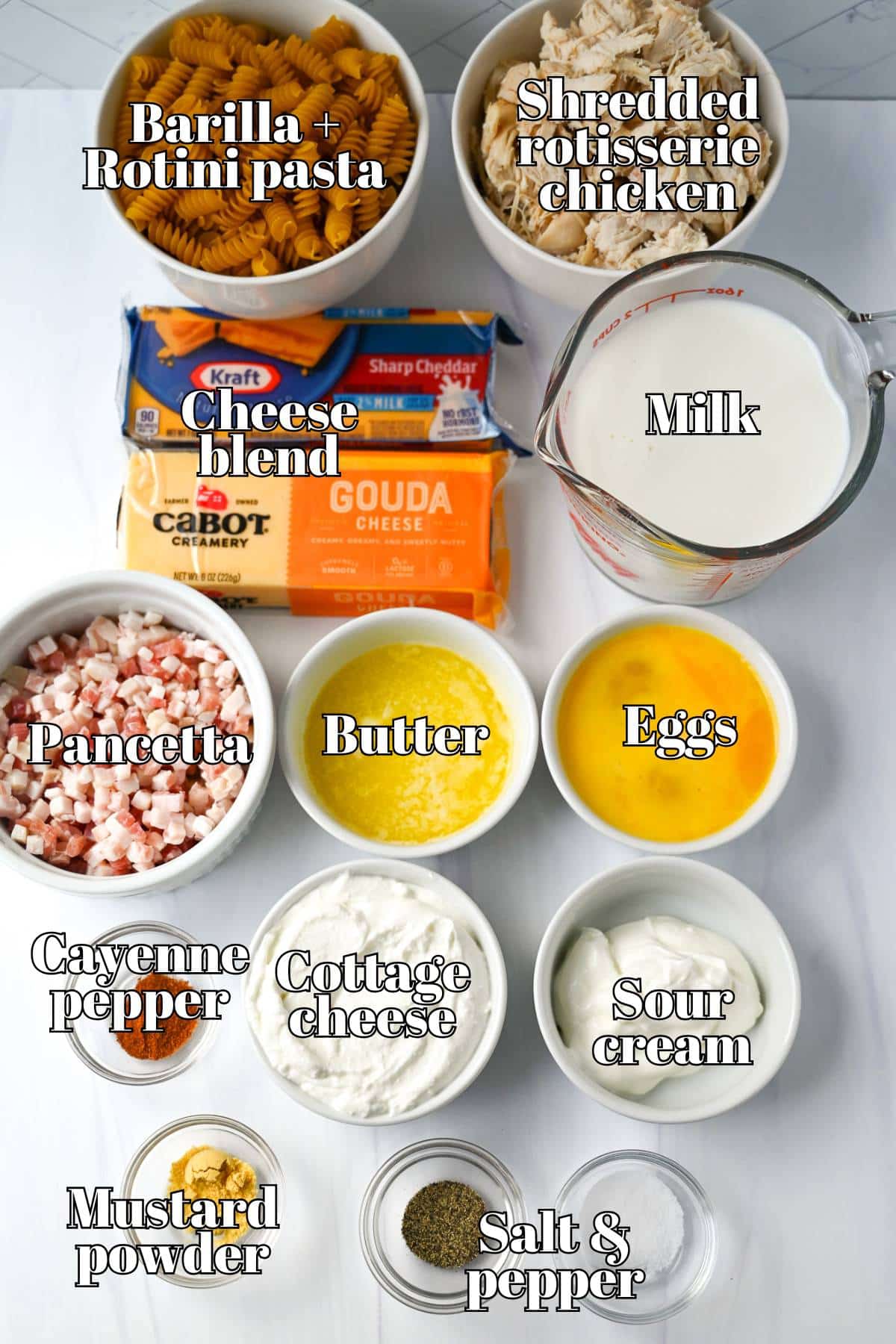 ingredients for high protein mac and cheese with rotisserie chicken measured out on a counter