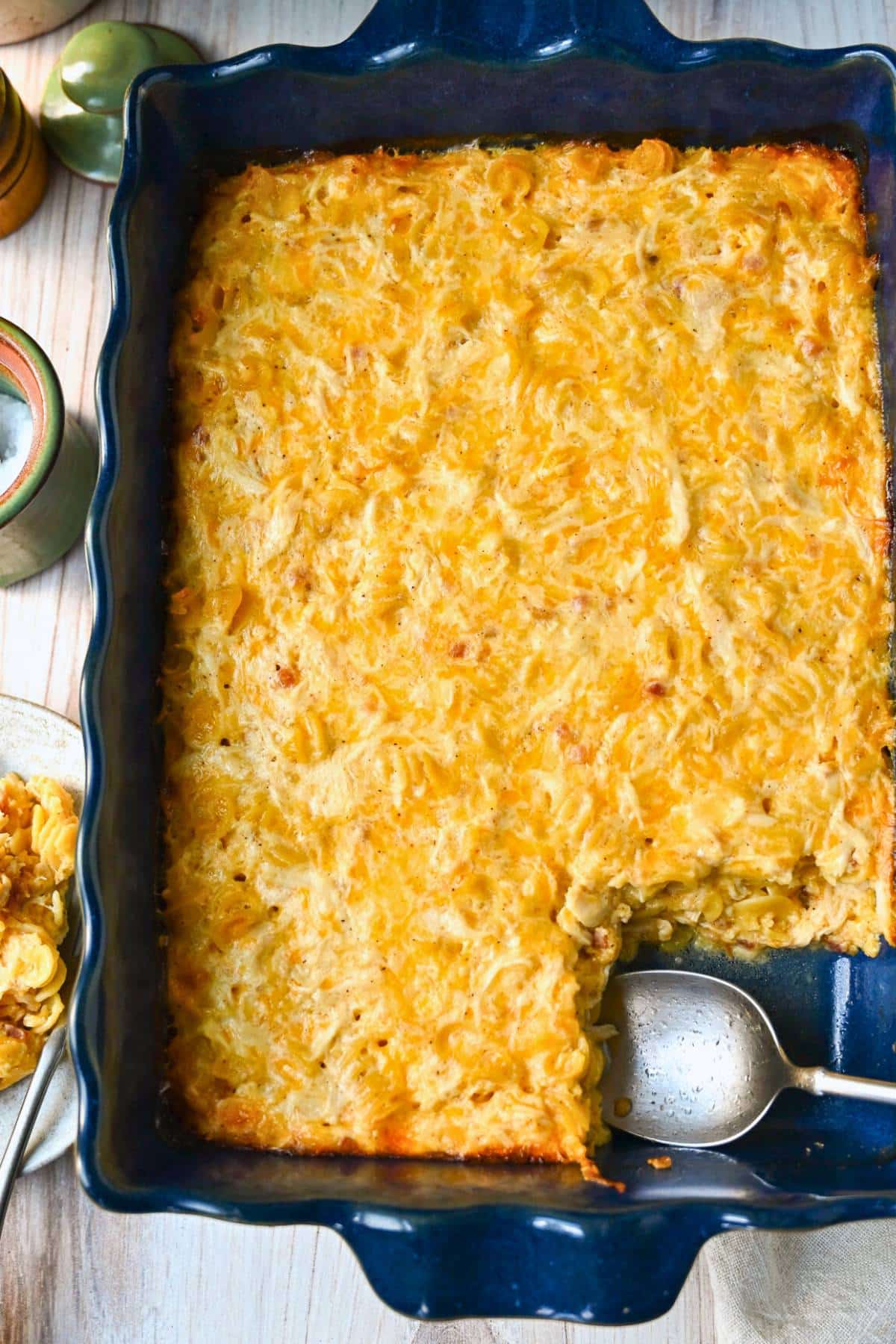a pan of protein mac and cheese with shredded chicken