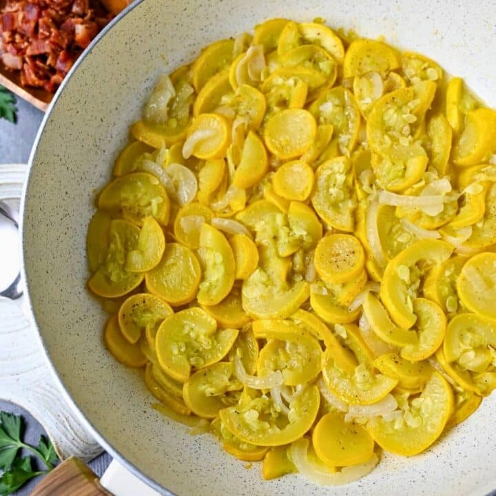 stewed squash in a white skillet