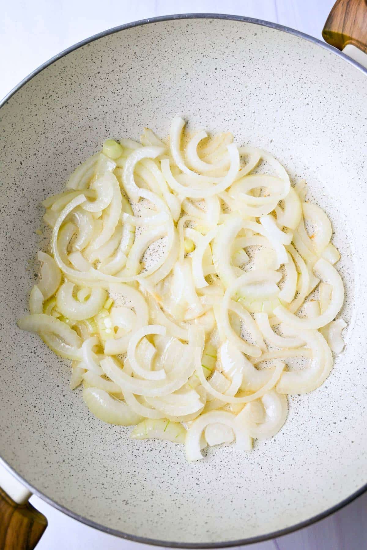 onions sauteeing in a skillet