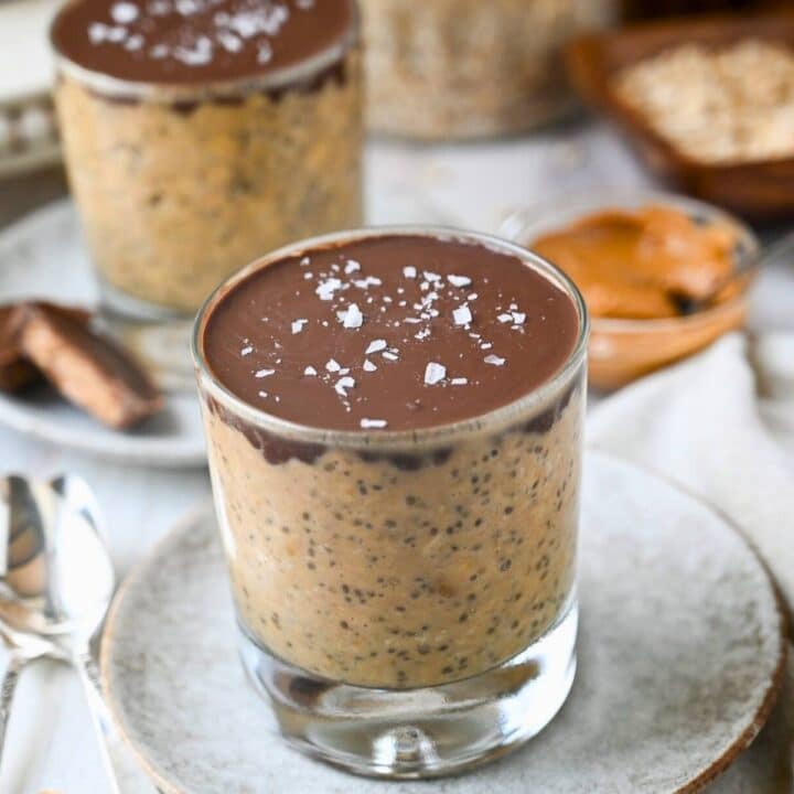 two jars of pb overnight oats with magic shell topping and flaked salt