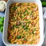 looking down at a pan of boursin tomato pasta with rotini noodles and Italian chicken sausage