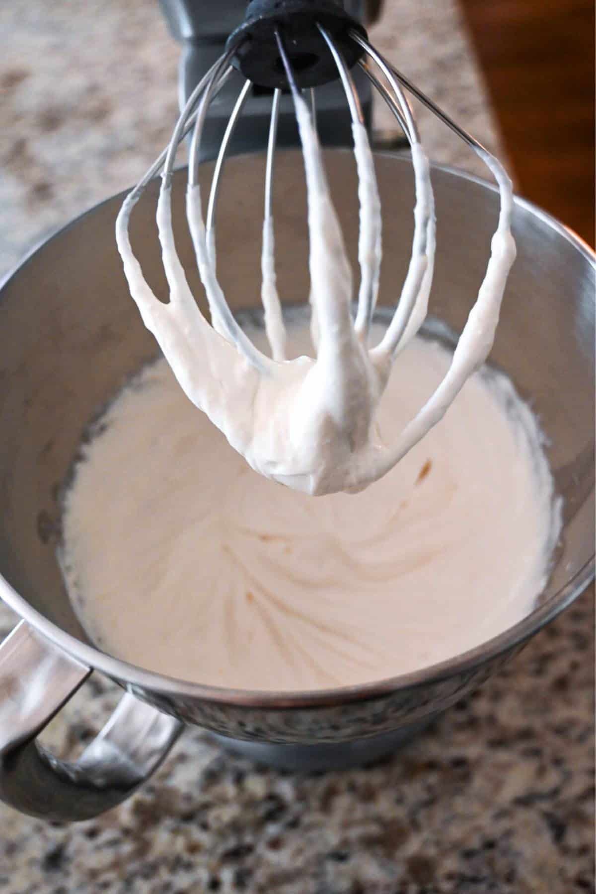 whipped cheesecake filling in a stand mixer