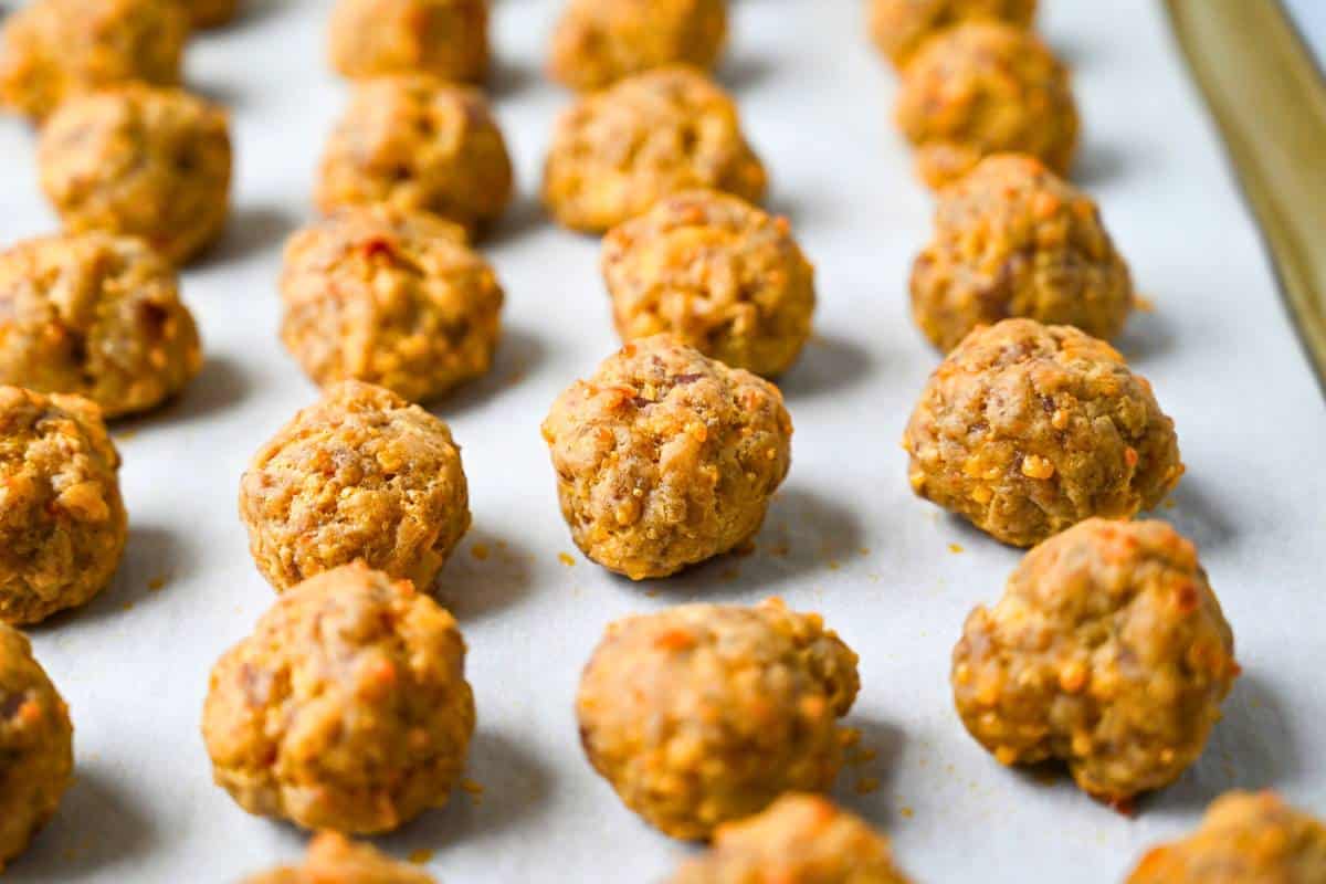 cooked sausage balls on a baking sheet