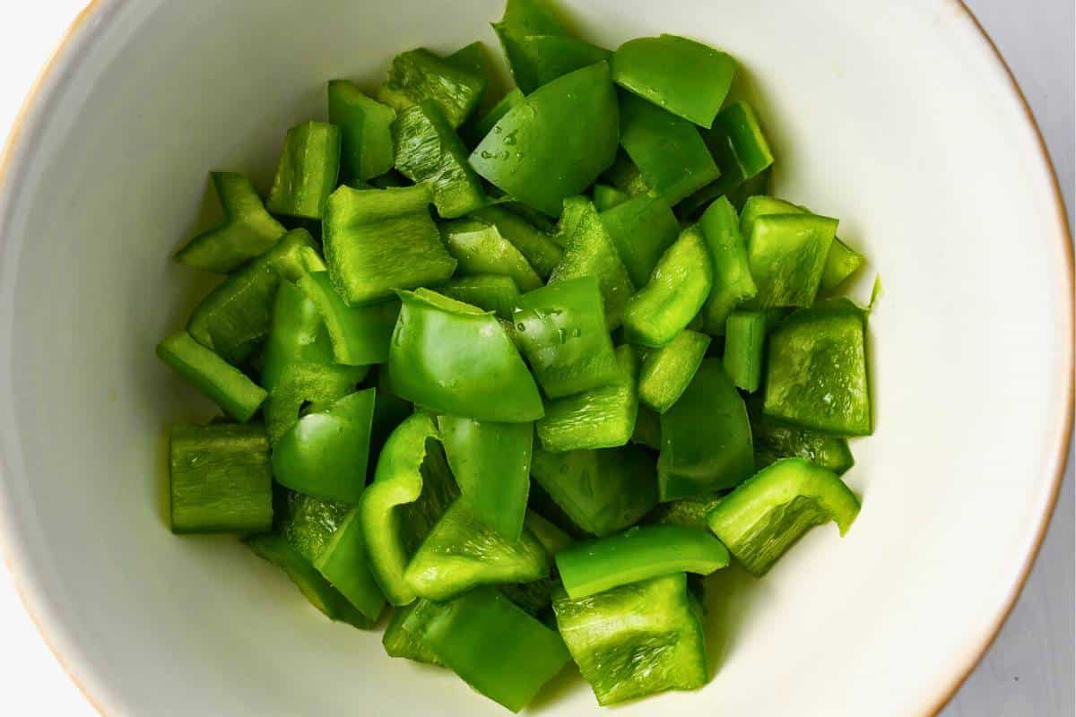 chopped green peppers in a bowl