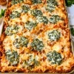 a sheet pan of lasagna with spinach and cheese