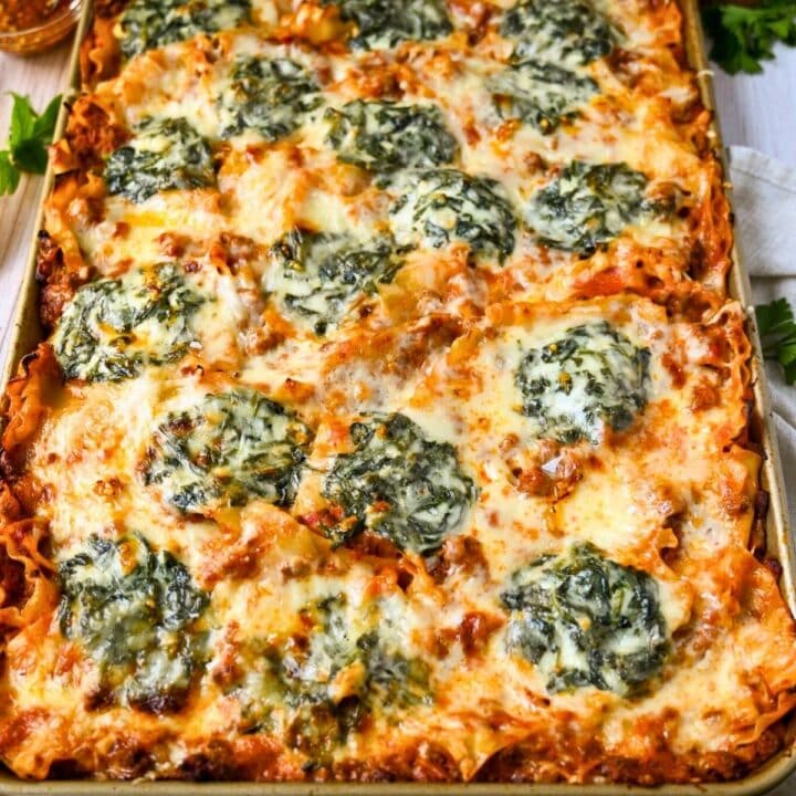 a sheet pan of lasagna with spinach and cheese