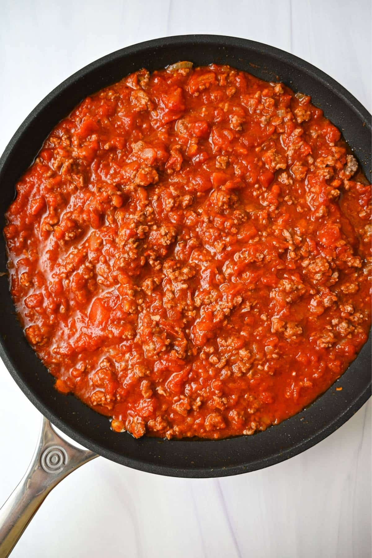 marinara sauce and ground beef in a skillet