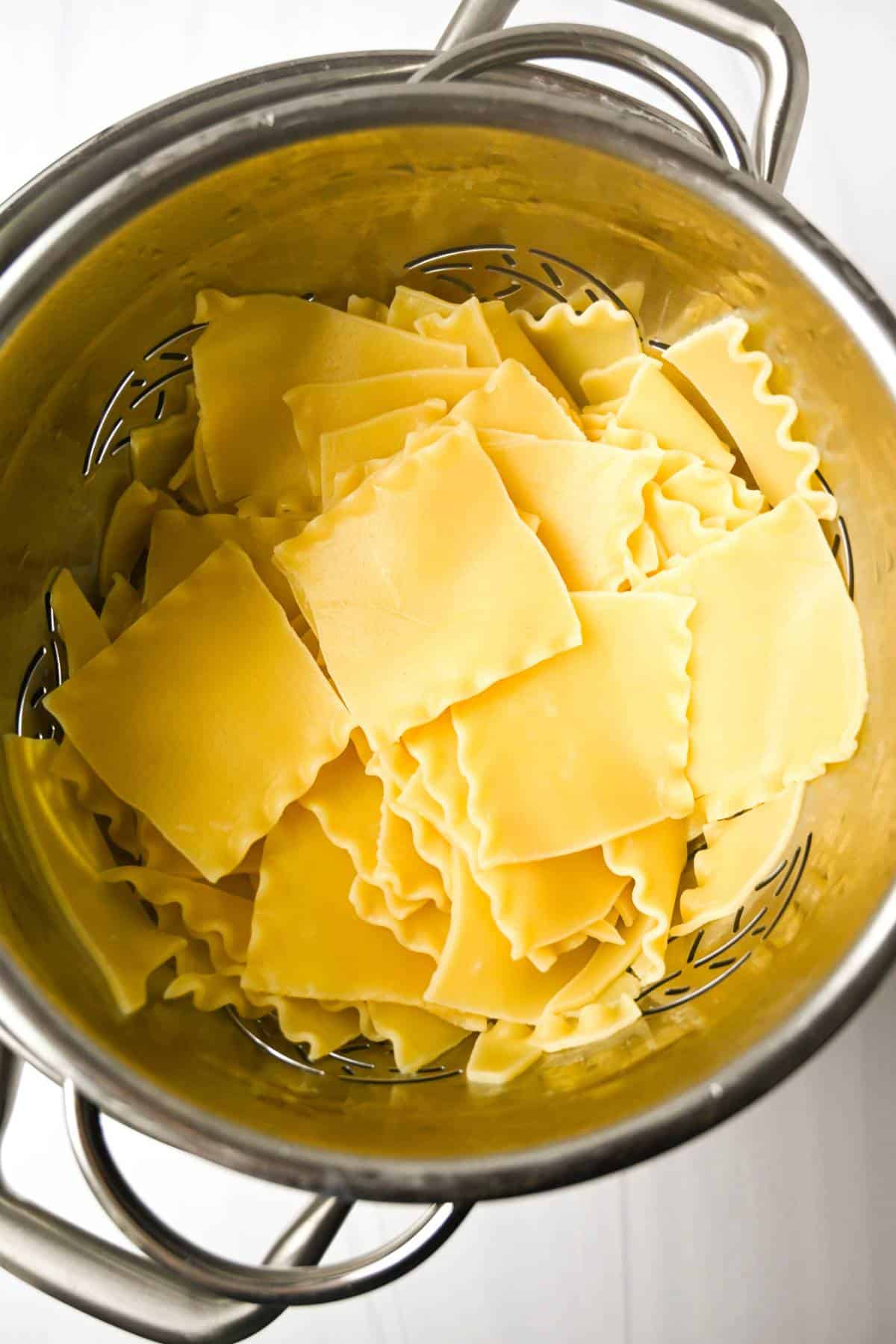 lasagna noodles cooked al dente in a colander