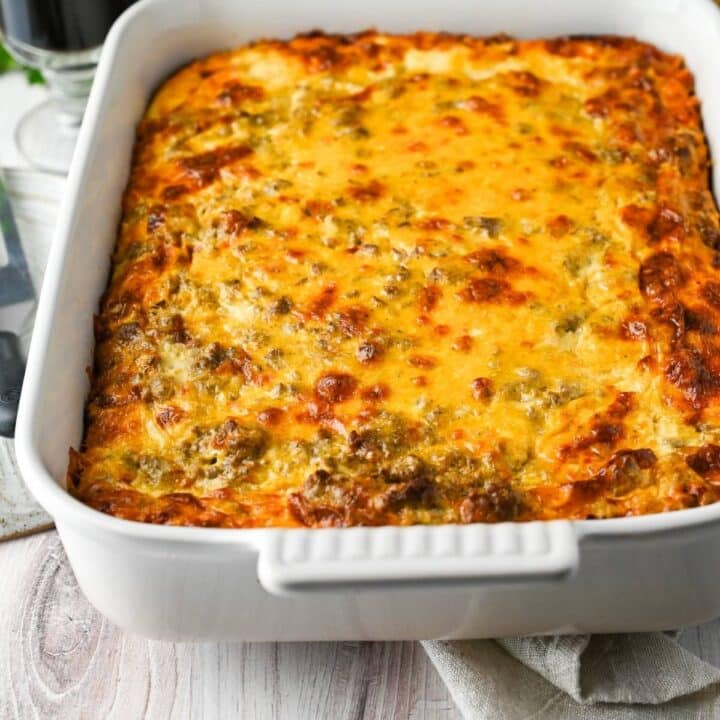 ground beef breakfast casserole in a dish with a napkin underneath
