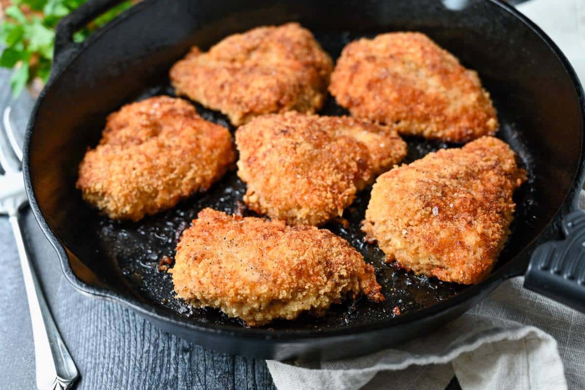 a pan of skillet fried chicken 