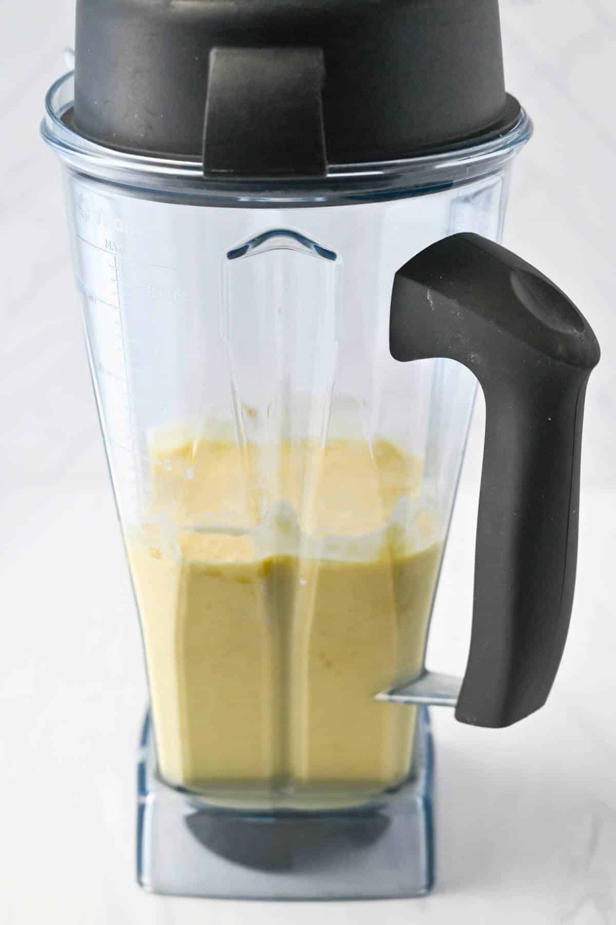 blended waffle batter in a Vitamix jar