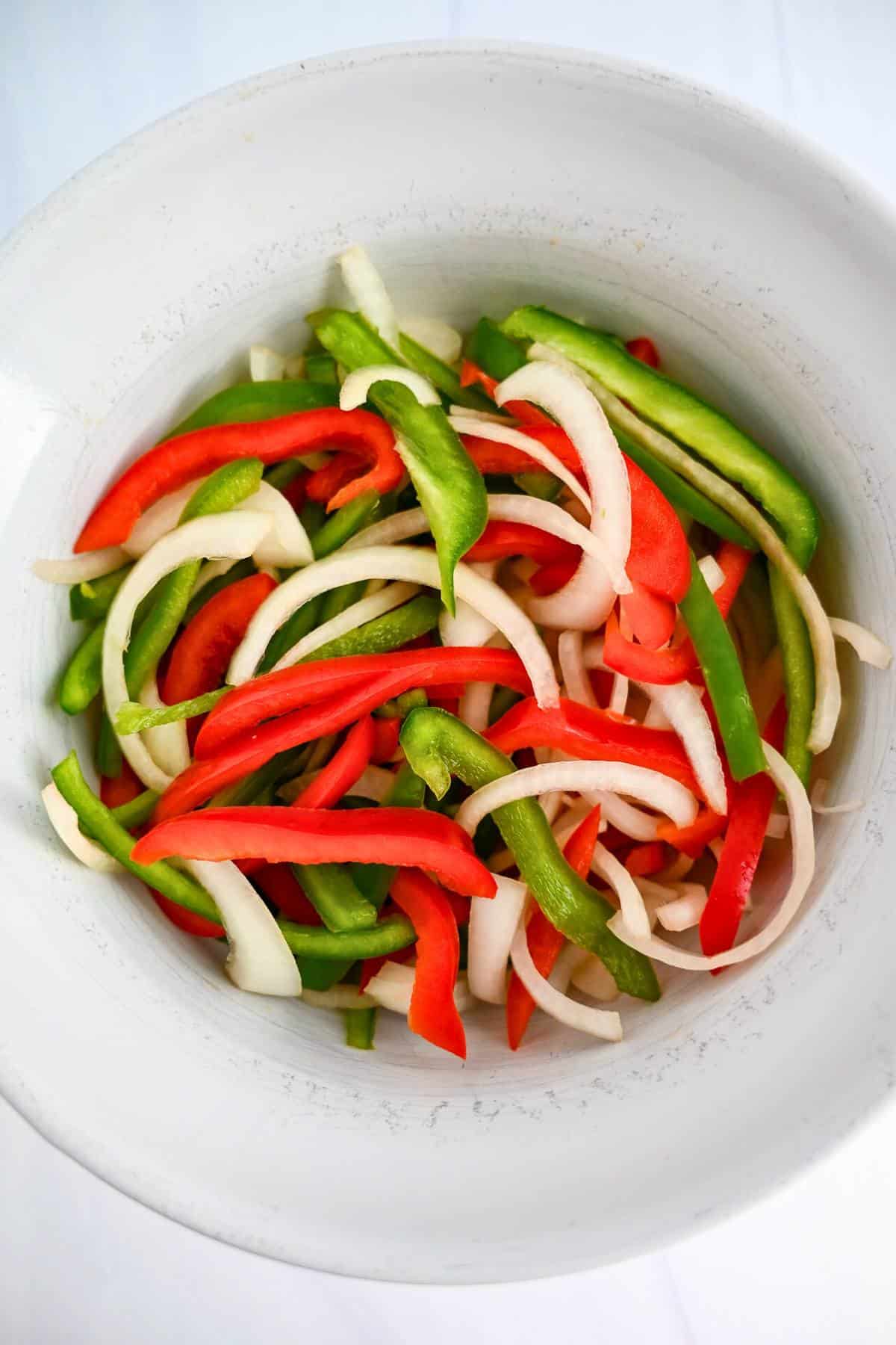 chopped peppers and onions in a bowl