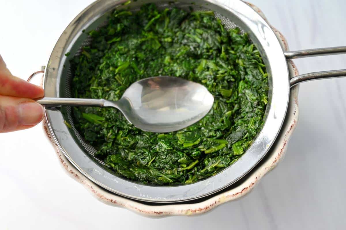 pressing the water out of cooked frozen spinach