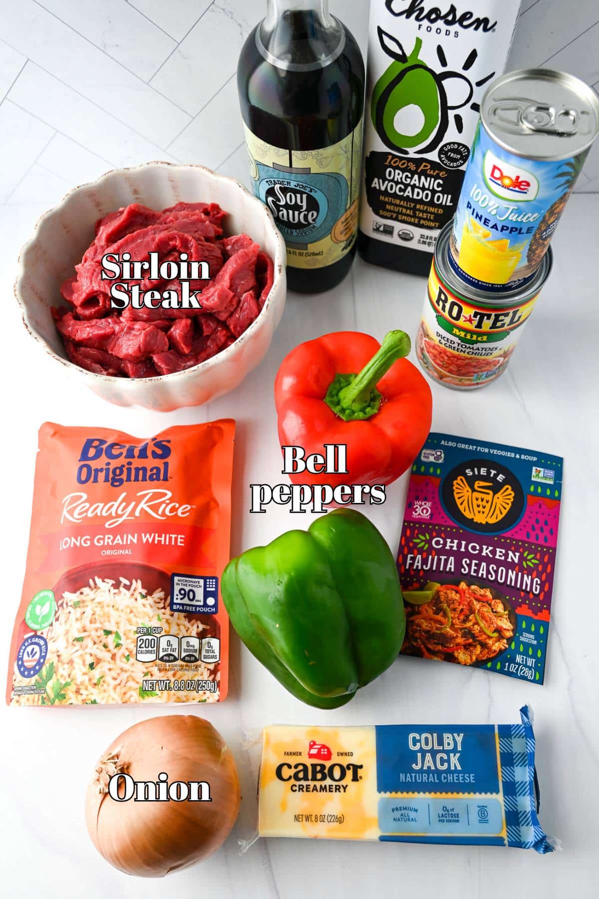 steak fajita skillet with rice ingredients on a counter top