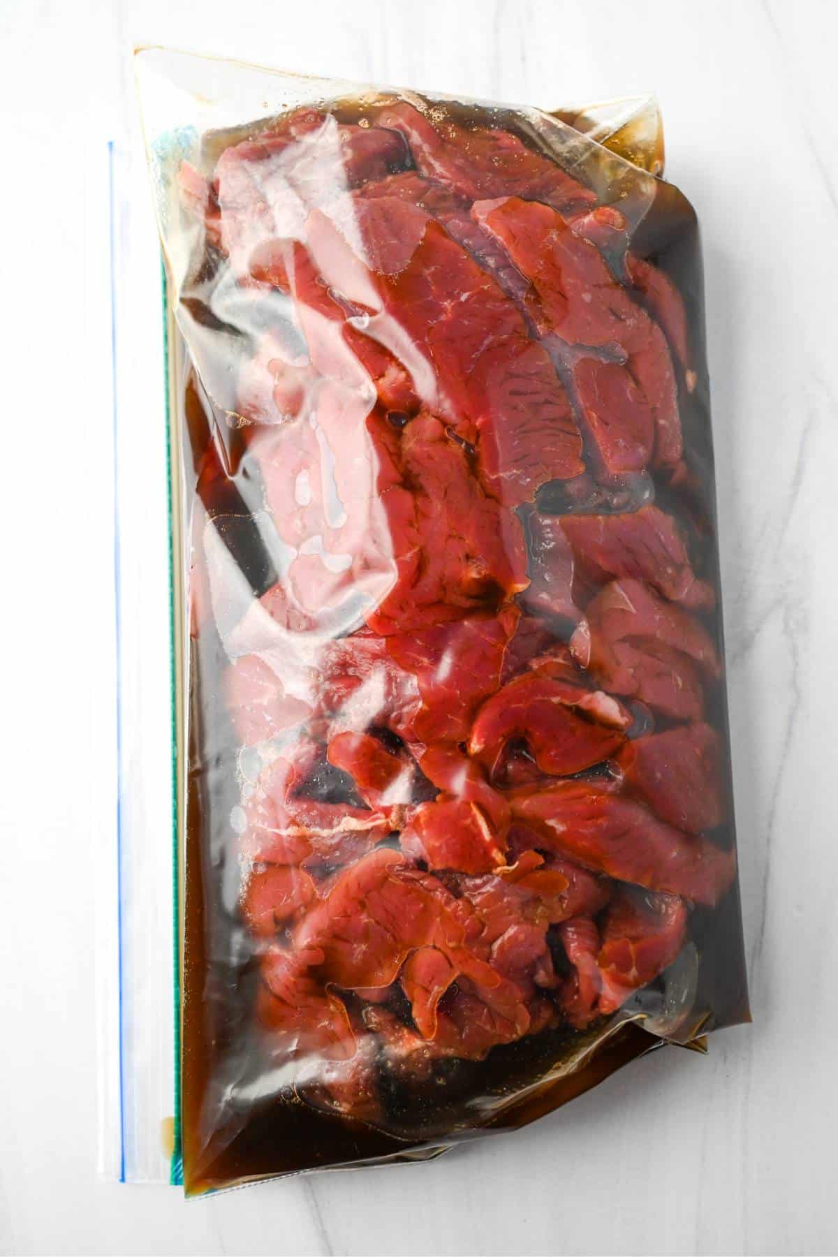 marinated steak in a ziplock bag