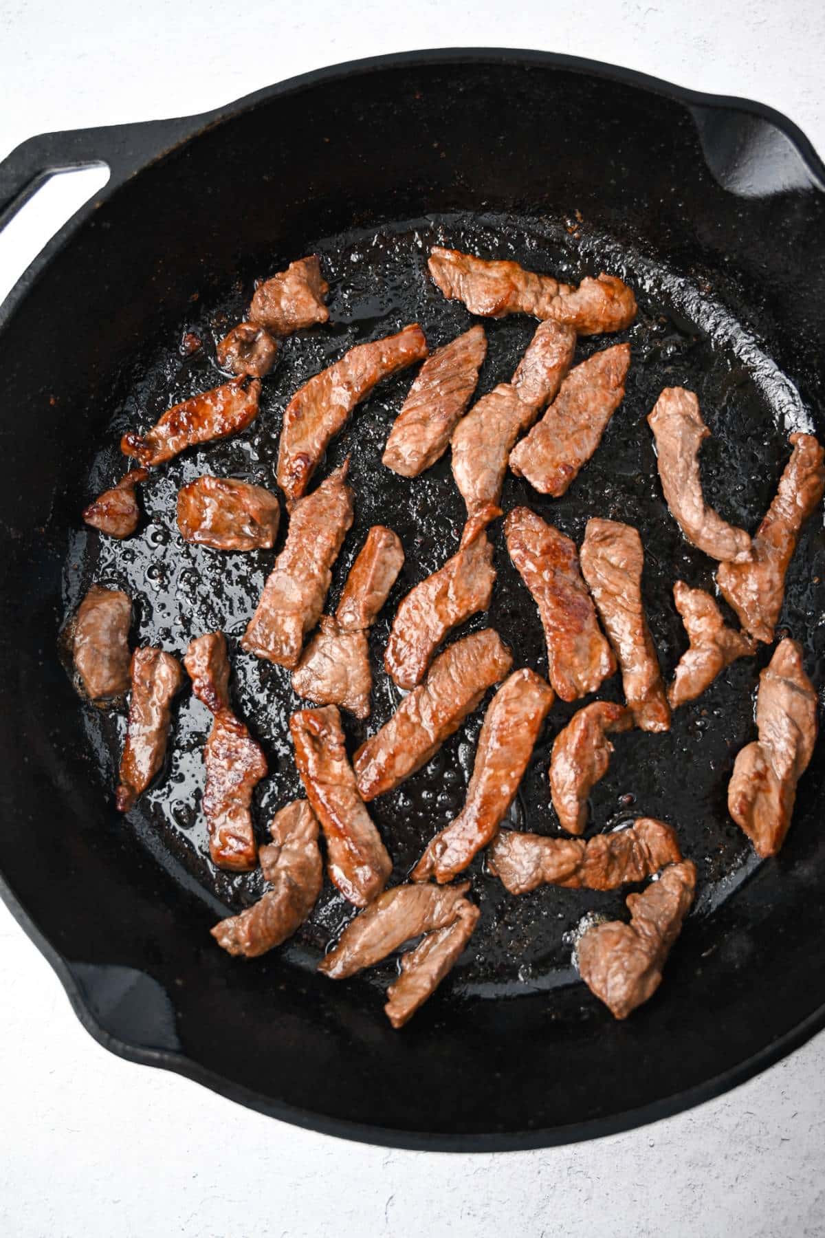 seared steak in a cast-iron skillet