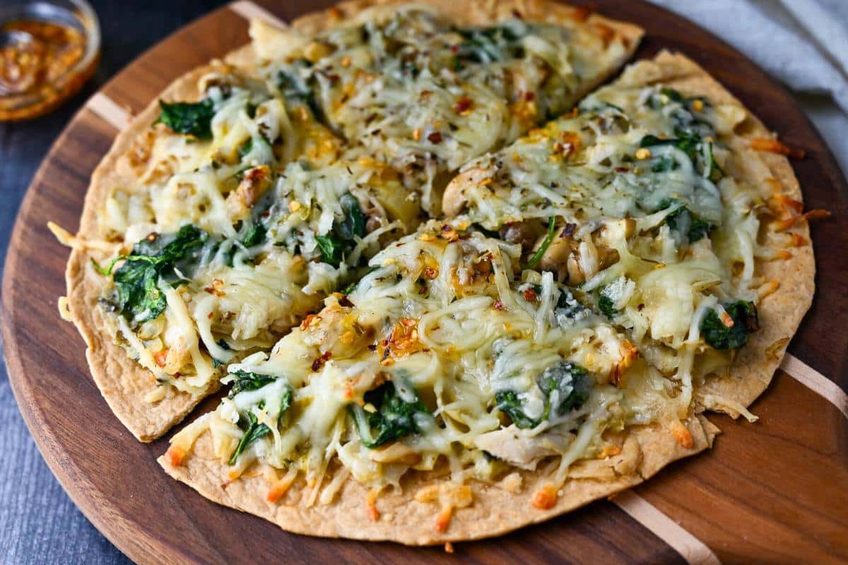 sliced tortilla pizza on a cutting board