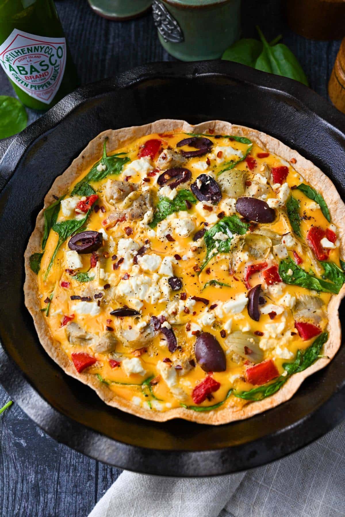 a tortilla breakfast egg quiche with mediterranean vegetables